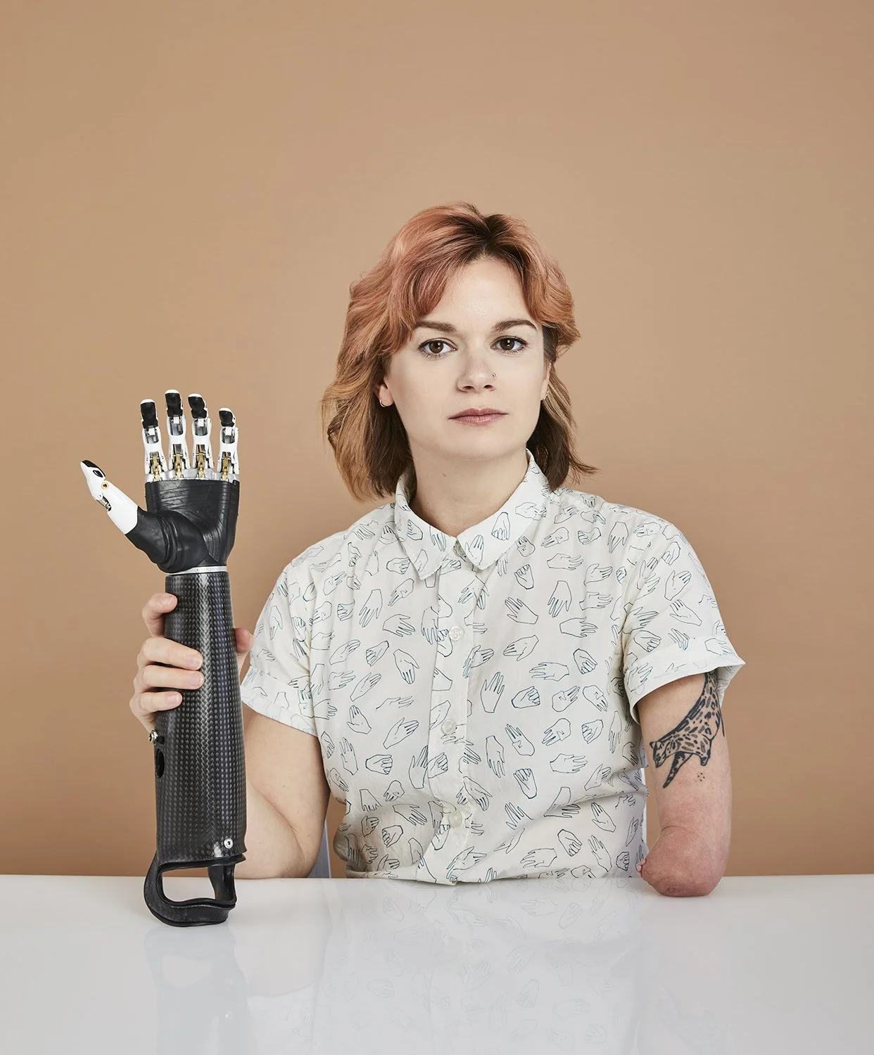 Portrait of writer Brittany Young with her prosthetic arm, photographed for IEEE Spectrum by Gabriela Hasbun.