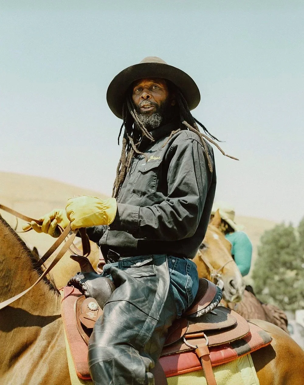 Cowboy Dugga riding his horse in Oakland, photographed by San Francisco–based photographer Gabriela Hasbun.