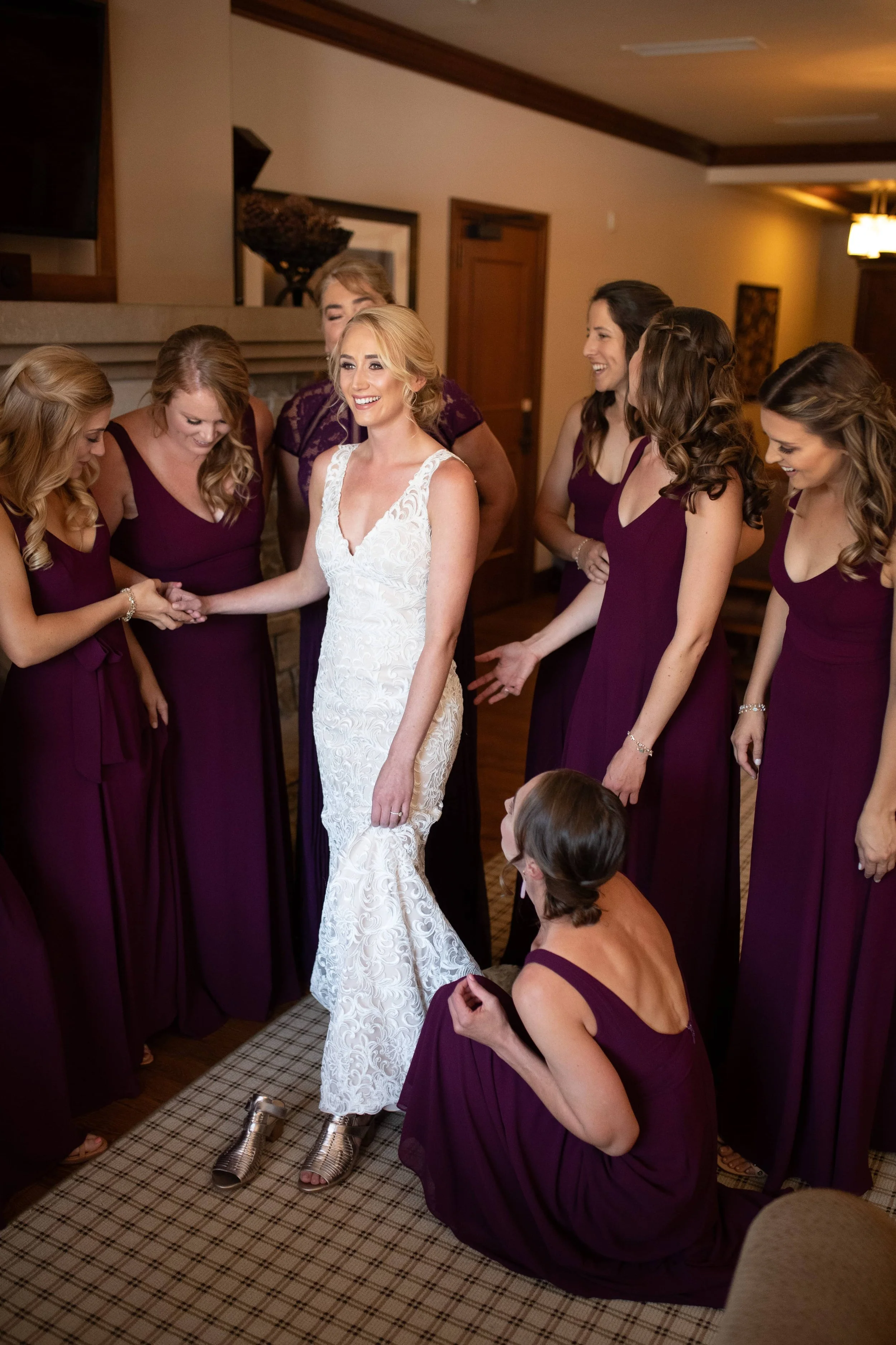 bride getting in wedding dress.jpg