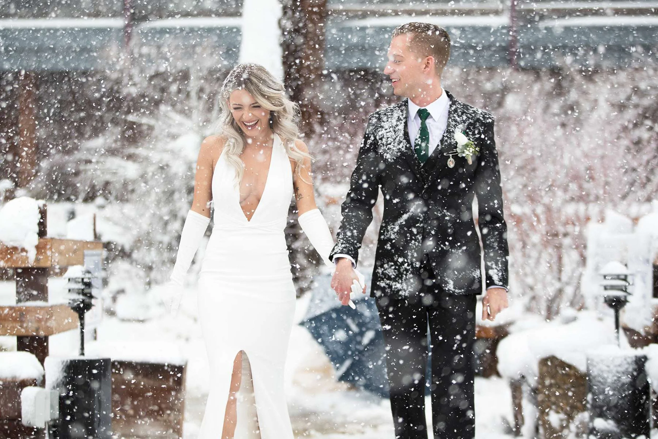 bride and groom in the falling snow Tahoe