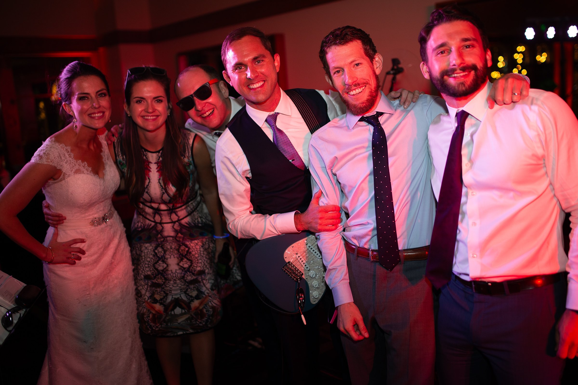 wedding-guests-posing-with-married-couple.jpg