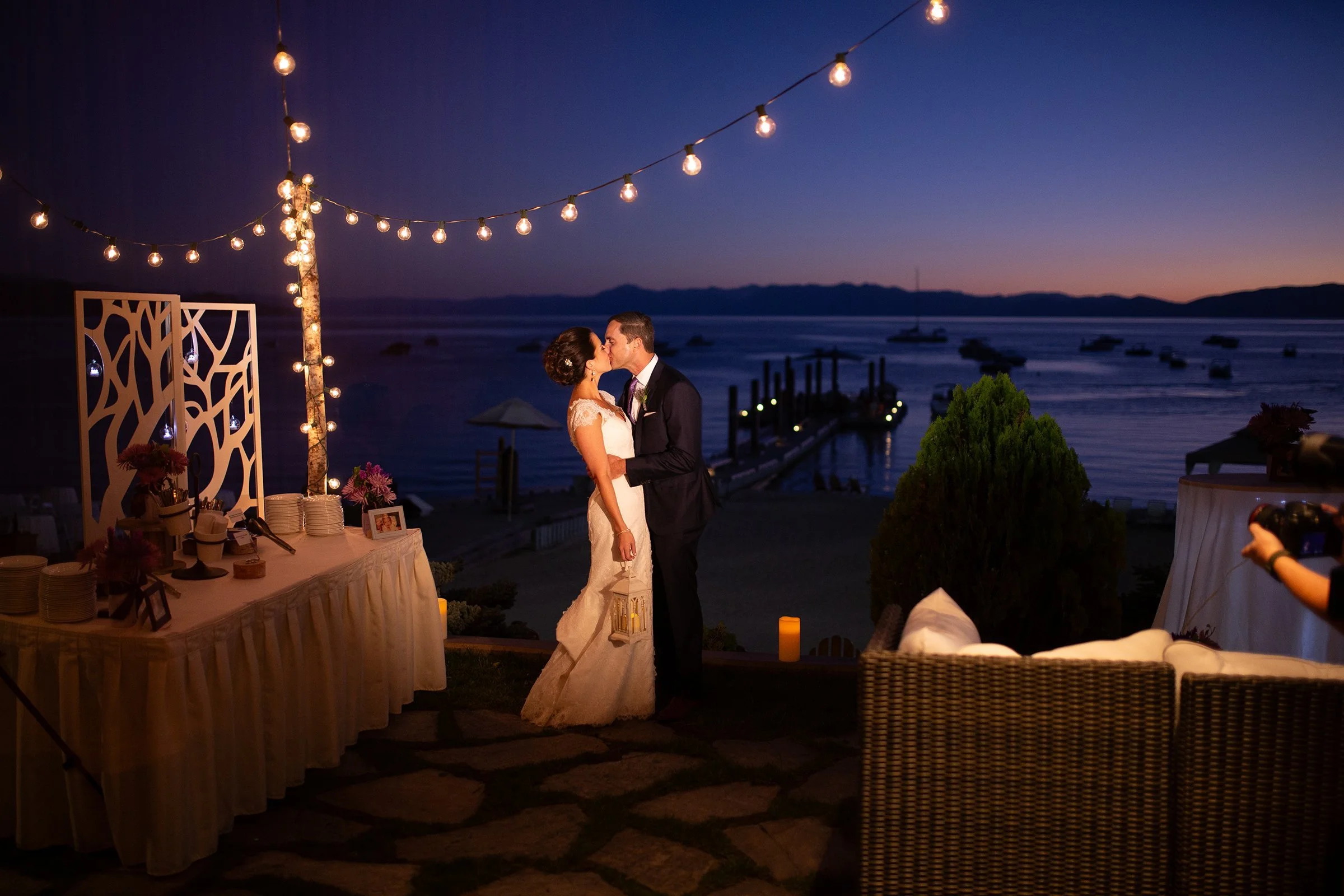 kissing-bride-and-groom-with-lake-tahoe-as-a-backdrop-.jpg