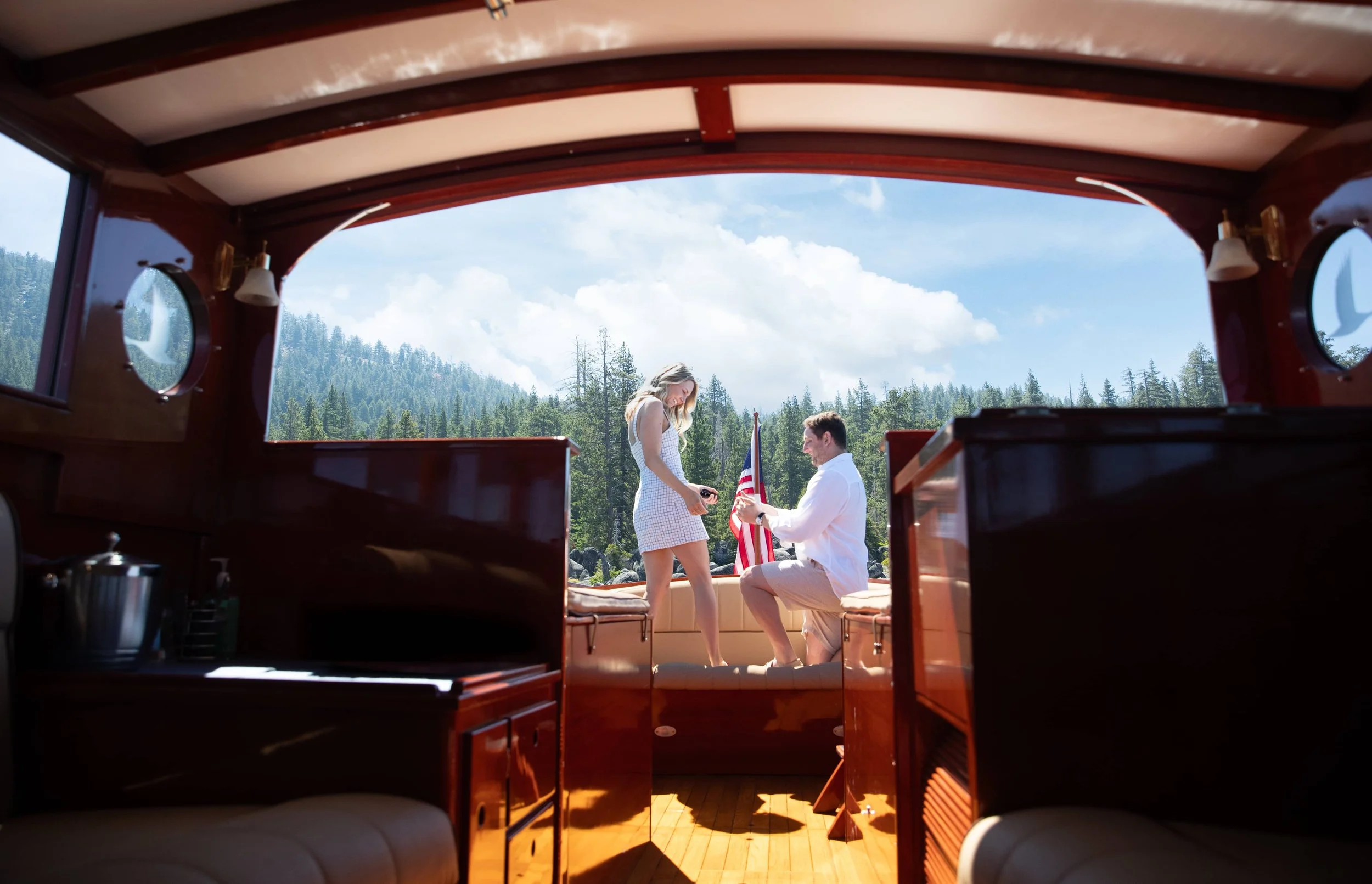 Man down on one knee proposing to his partner at Lake Tahoe, candid proposal photography by Ciprian Photography