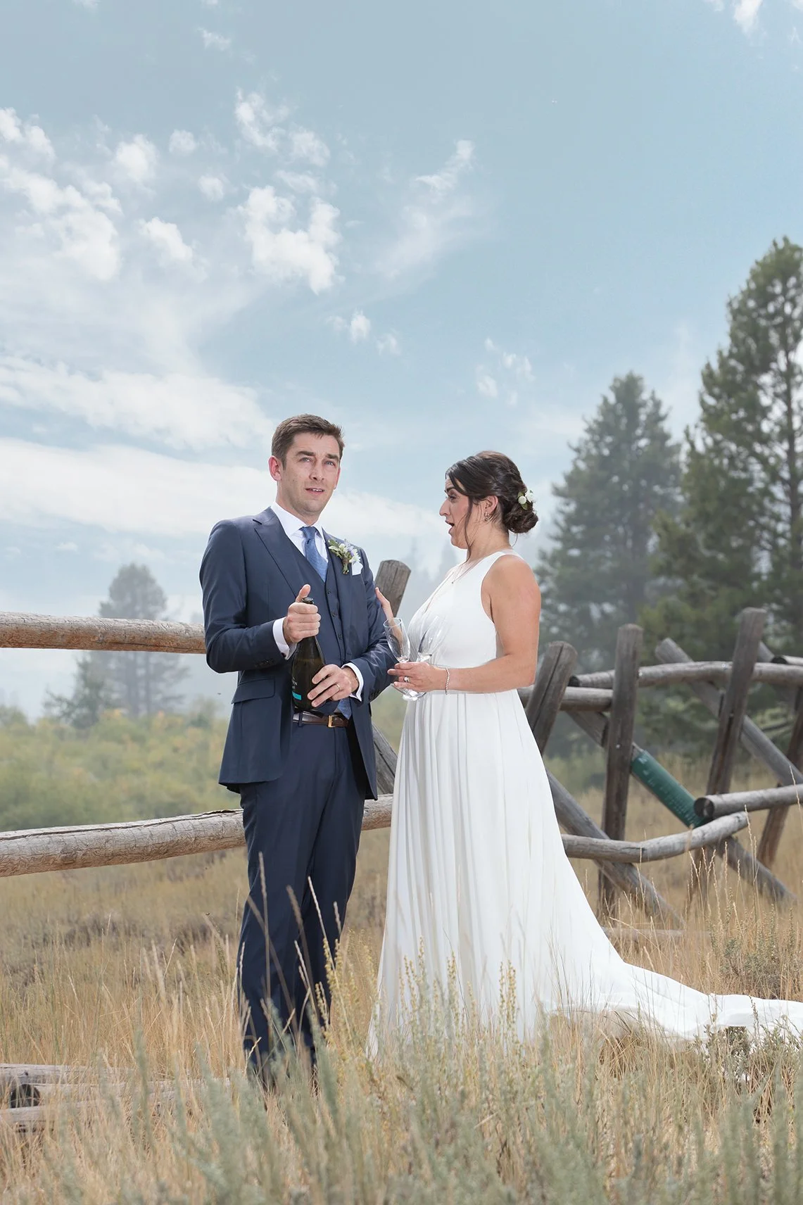 bride-and-groom-opening-champagne.jpg