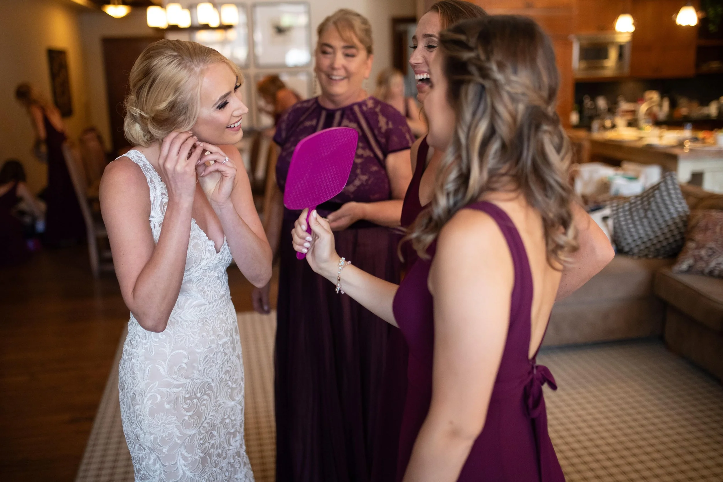 bride putting earings on.jpg