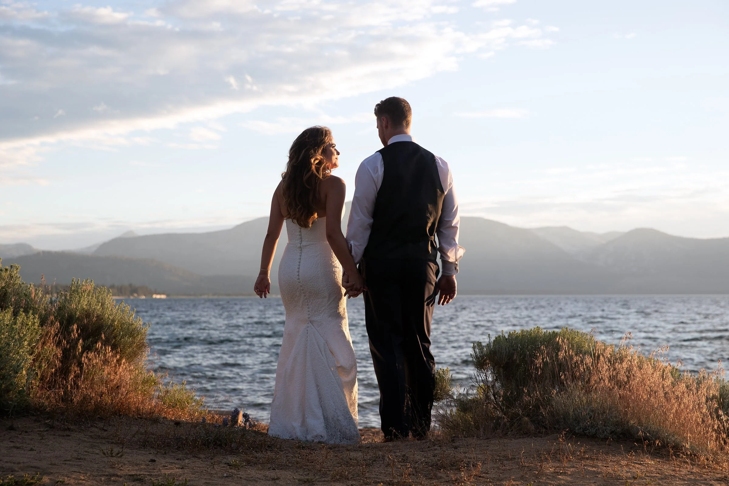 bride-and-groom-at-sunset-on-the-beach-Edgewood-Tahoe.jpg