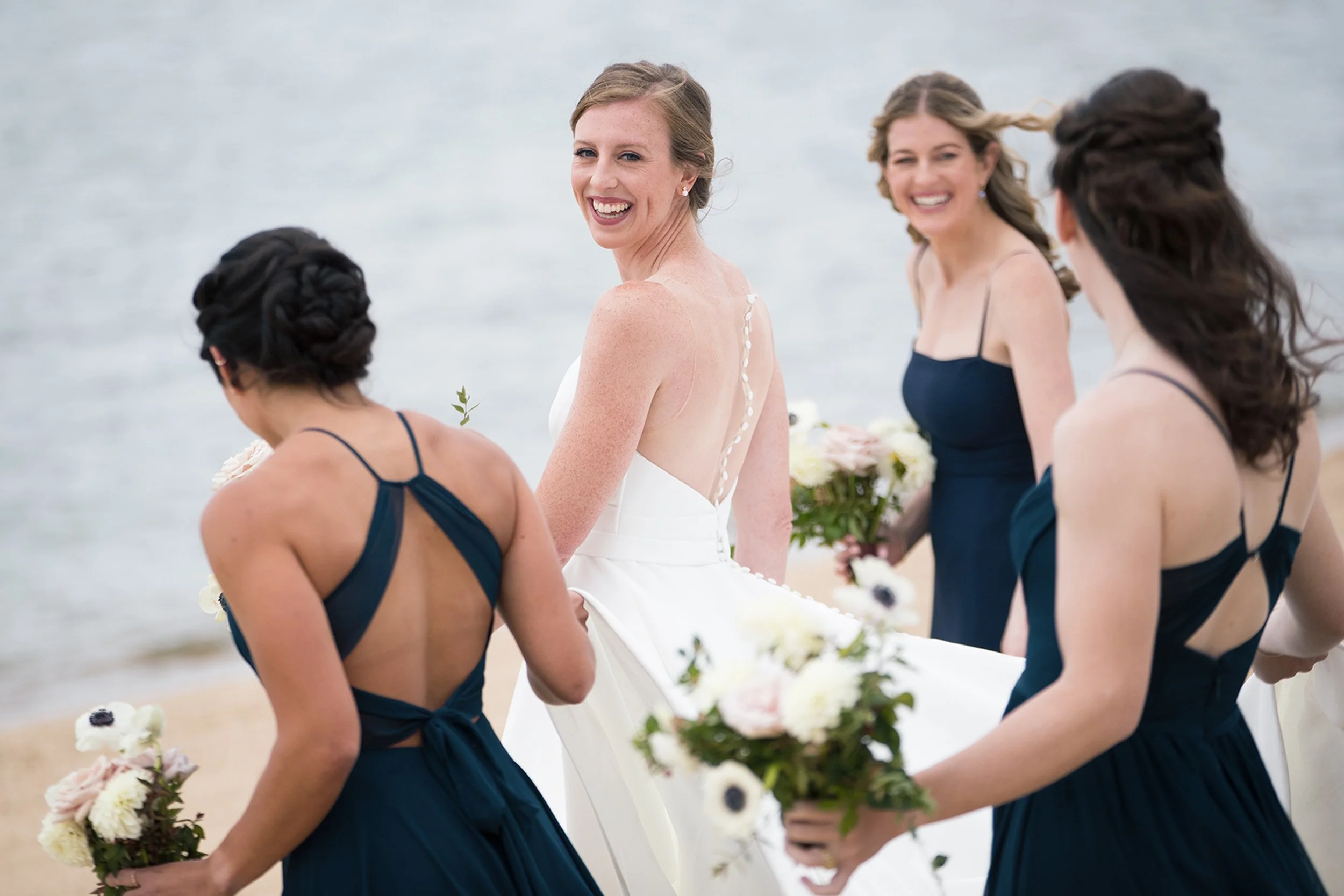 bride with bridesmaids on beach South Tahoe