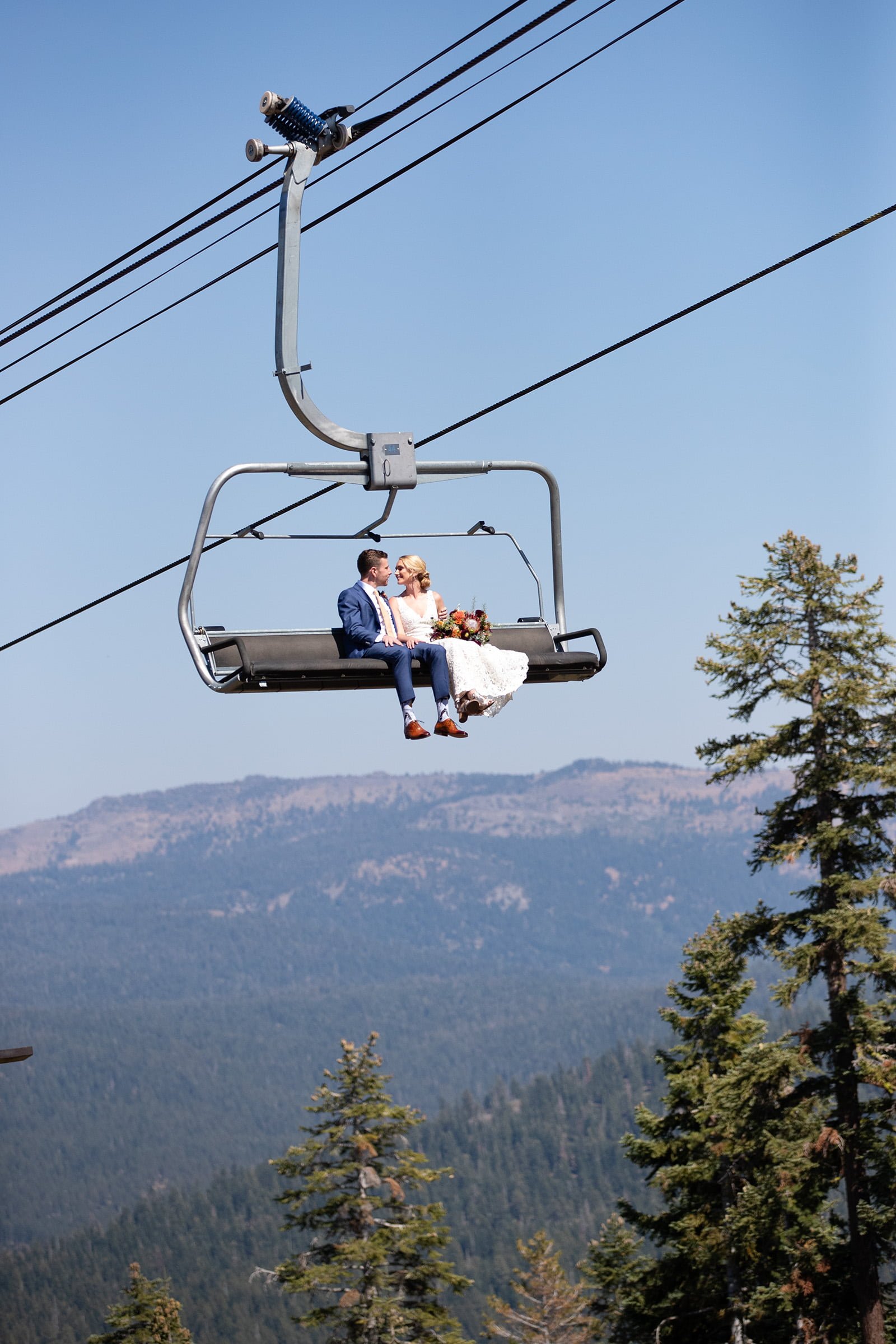 bride and groom on chairlift.jpg