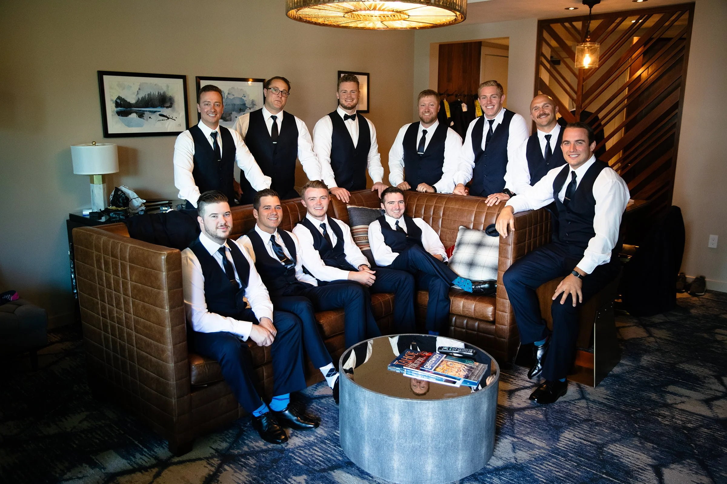 A relaxed moment with the groomsmen inside the Edgewood suite, where clean lines, soft window light, and genuine camaraderie set the tone for the day.