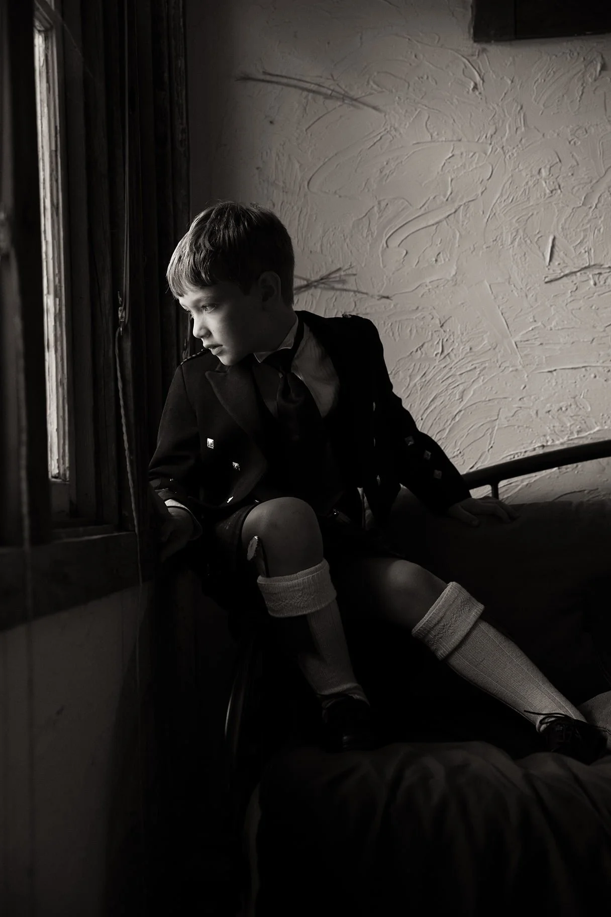 boy by the window wedding.jpg