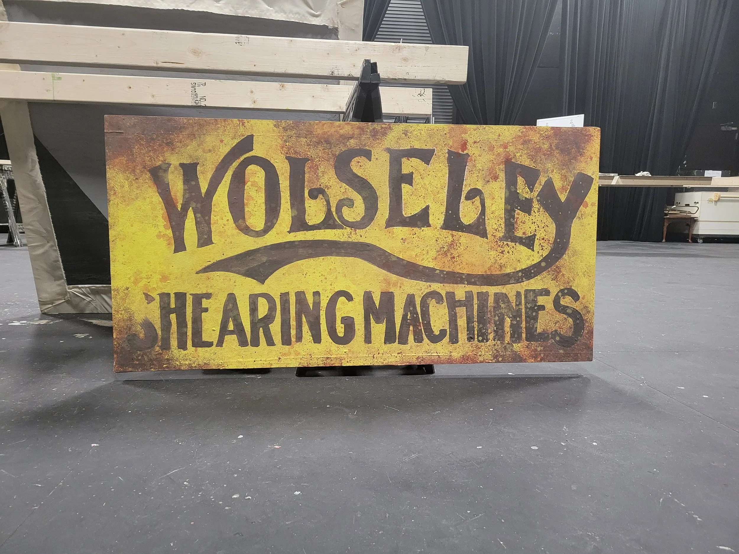 Ghost Sign - Free hand and stencil, mixing paints, dry brushing shadows and highlights, sponging rust, and splatter. 