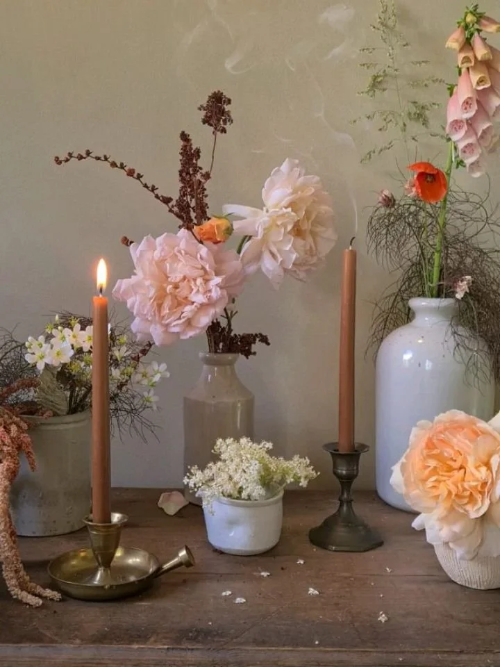 Vintage tones in antique vessels.
Limewash walls and rustic furniture.
Caramel tapers in brass and bronze.

A vase can be anything that holds water. My favourite table scapes are those that use a mix of what's available, usually earthenware and jugs.