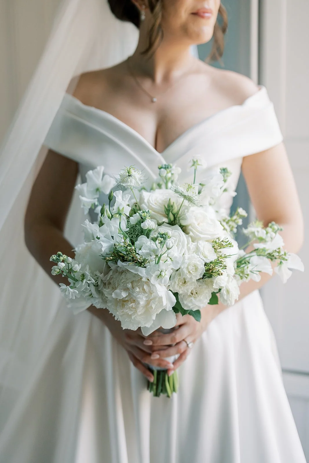 Simple white elegance. This bouquet contain beautiful sweet peas, peony, nigella, stocks and roses