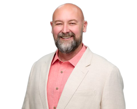 Gabe Smith, A smiling man with a beard, wearing a light-colored blazer and a pink shirt.