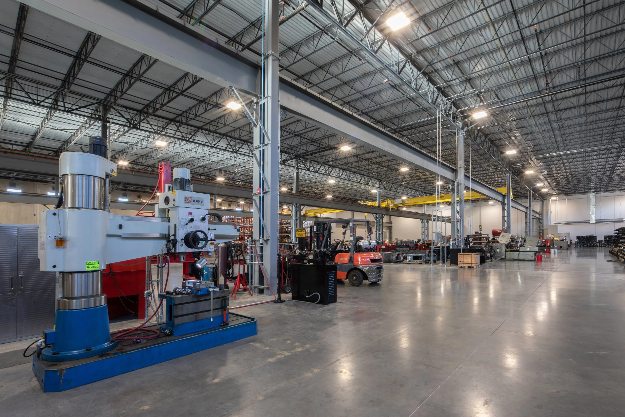 Motion Industries Fluid Power Shop  industrial warehouse with high ceiling and exposed structure and polished concrete floors. project by B Group Architecture, Inc.