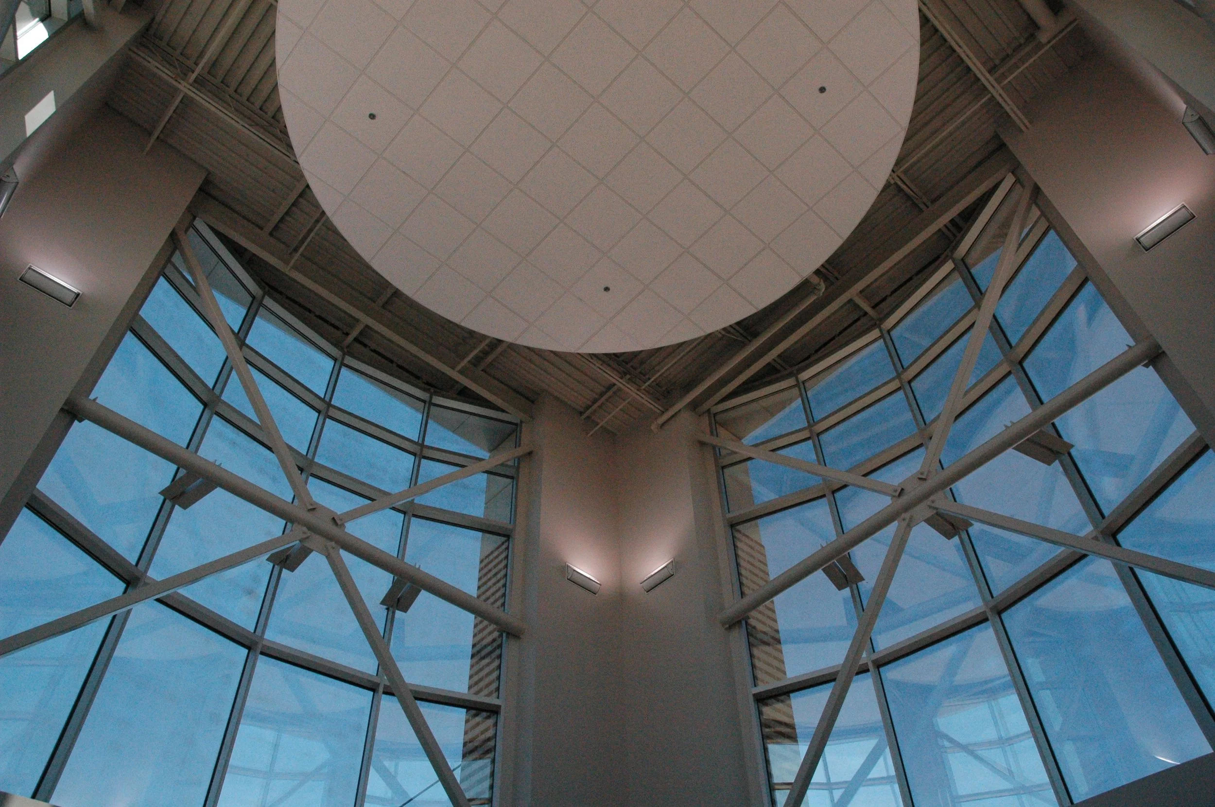 Interior view of the Mountain Brook High School entrance double story space with windows, exposed structure and suspended ceiling.- project by B Group Architecture, Inc.