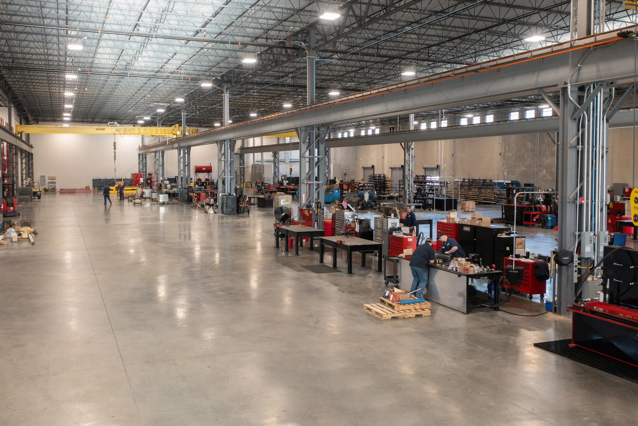 Motion Industries Fluid Power Shop  industrial warehouse with high ceiling and exposed structure and polished concrete floors. project by B Group Architecture, Inc.