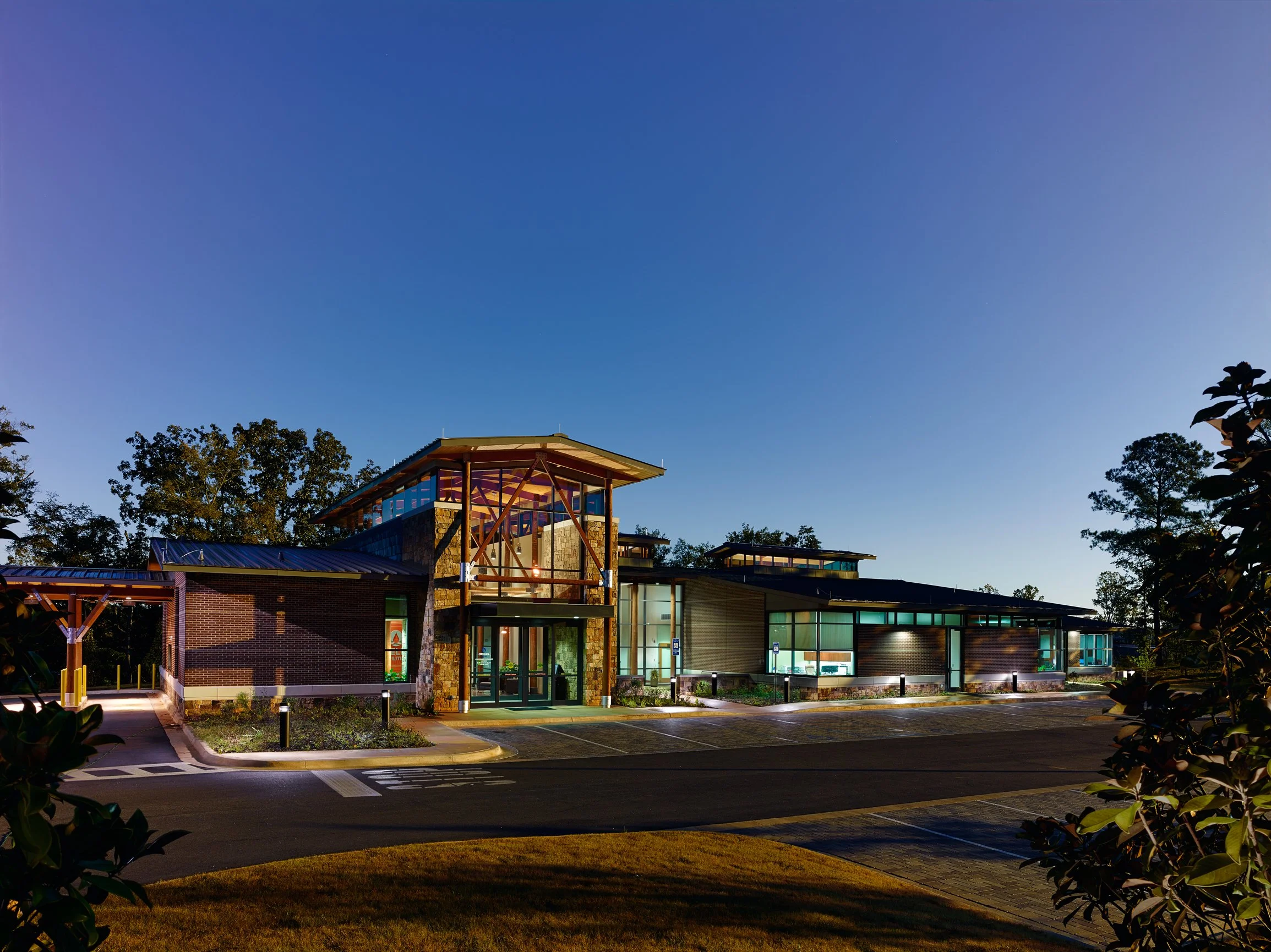 Water treatment plant's that combines industrial forms, a natural materials palette, transparency, and crisp detailing to produce a contemporary building.