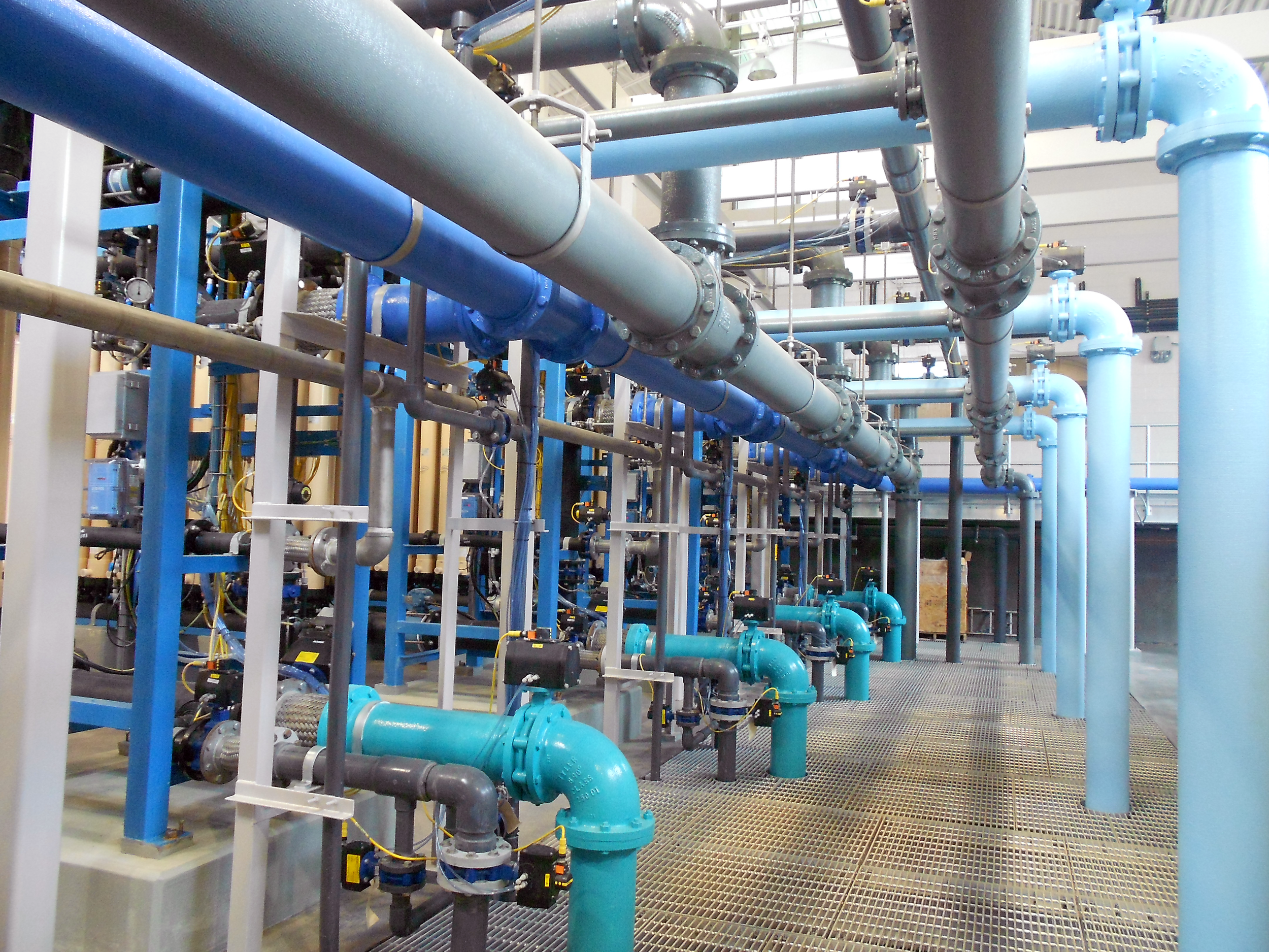 Industrial water filtration system with multiple inside a spacious, well-lit facility at Ft. Benning Water Treatment Plant - project by B Group Architecture, Inc.