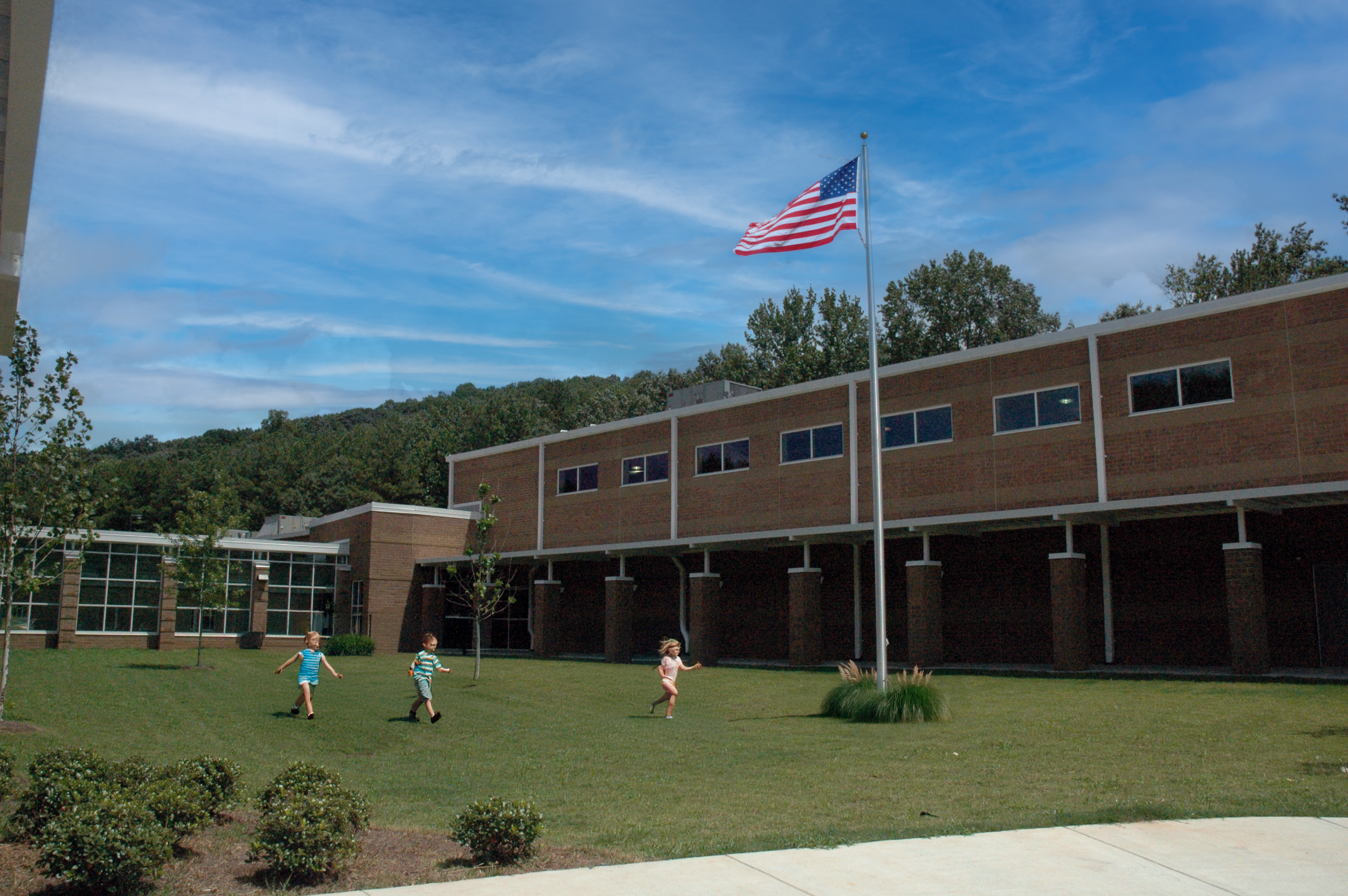 Oliver Elementary School with a modern brick and glass exterior. Brick pier colonnade.  - project by B Group Architecture, Inc.