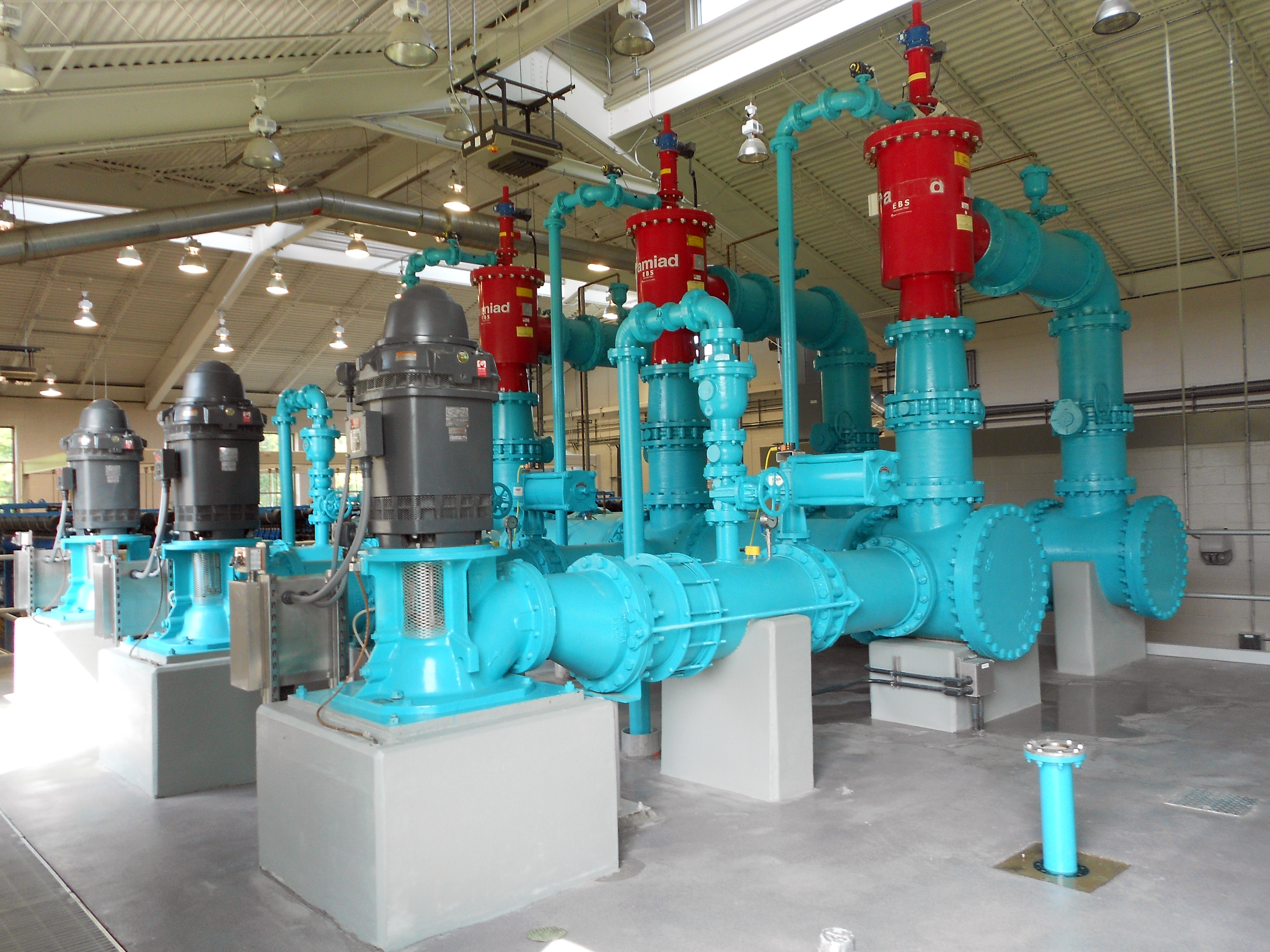 Industrial water filtration system with multiple inside a spacious, well-lit facility at Ft. Benning Water Treatment Plant - project by B Group Architecture, Inc.