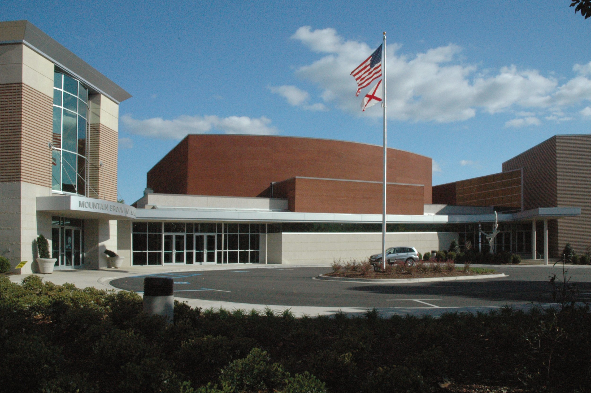 Exterior of Mountain Brook High School Fine Arts Center Addition with the use of brick and storefront- project by B Group Architecture, Inc.