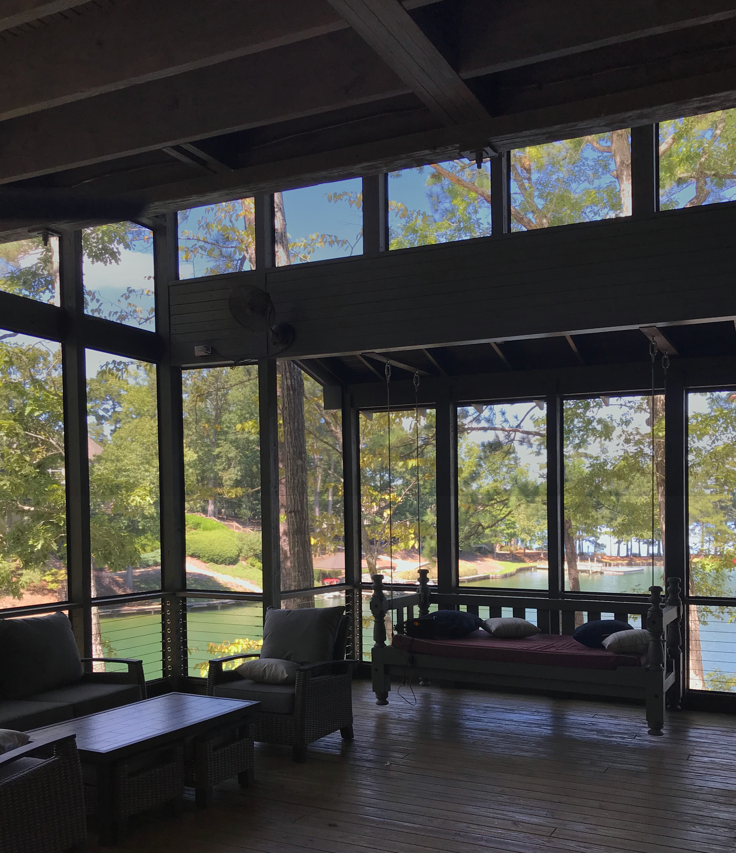 A screened porch at a lake house in Pelham, AL. taking advantage of increasing views of the natural landscape. project by B Group Architecture, Inc.