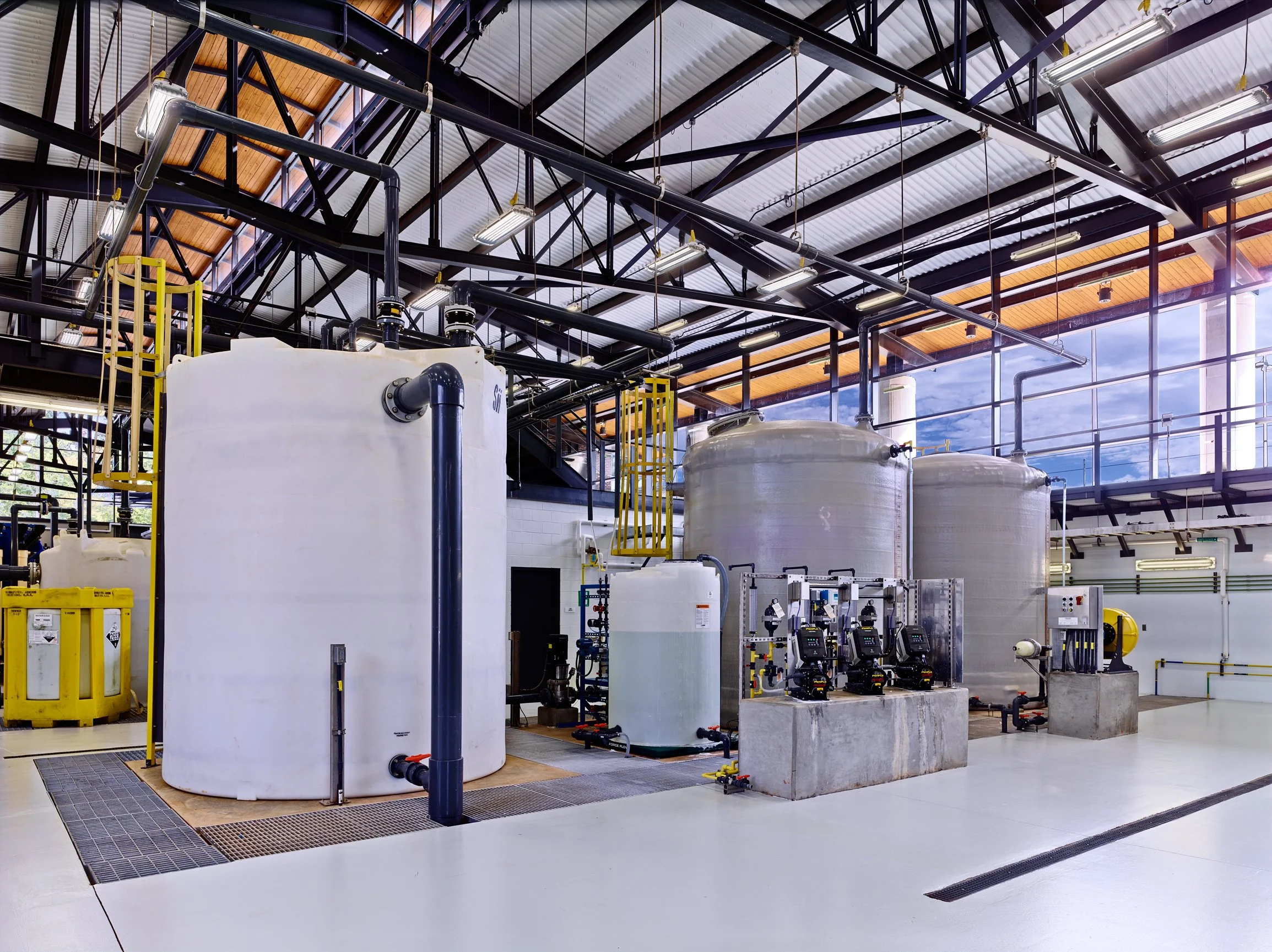 Industrial water treatment facility with tanks, and filtration equipment. project by B Group Architecture,  Inc.