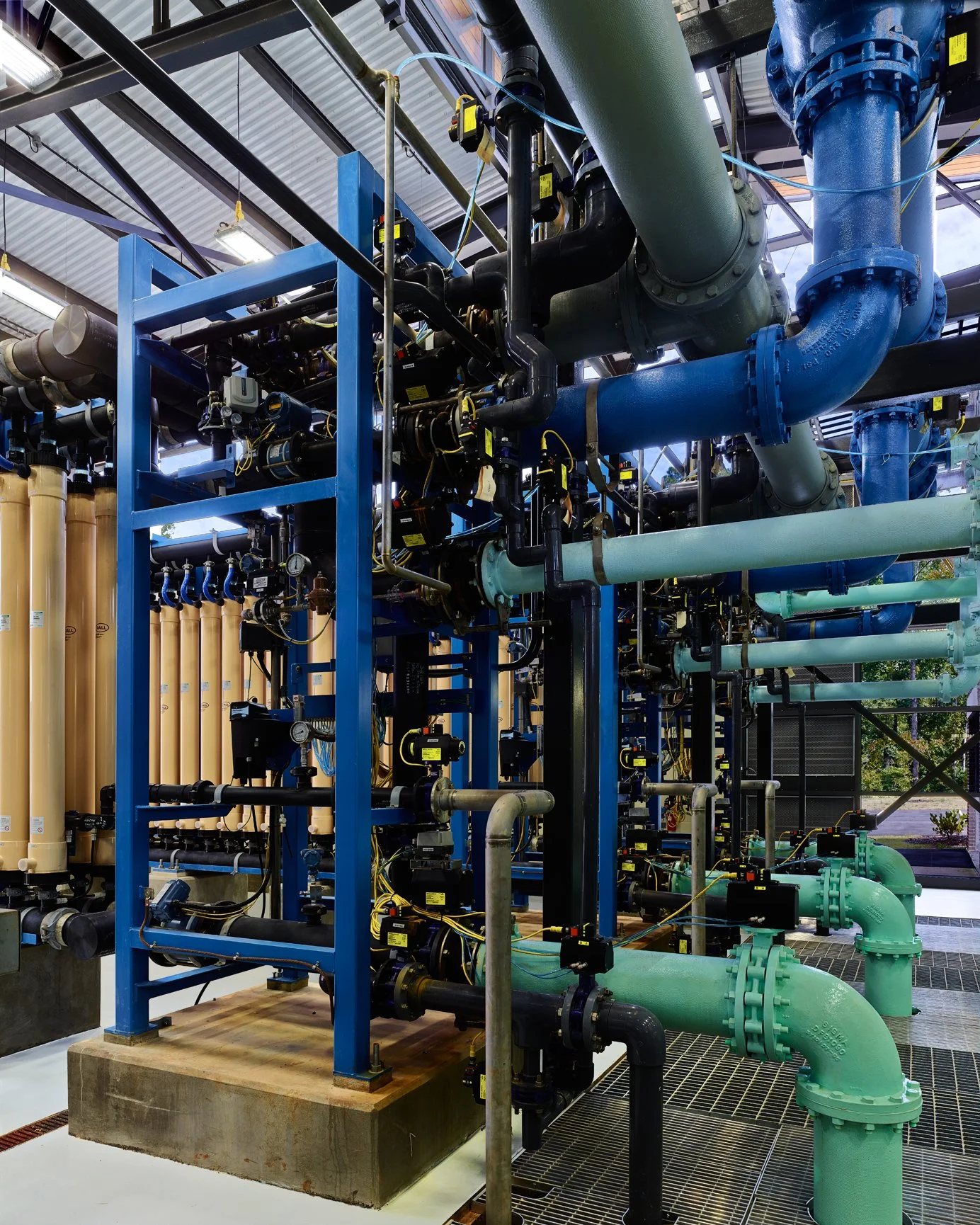 Industrial water treatment facility with tanks, and filtration equipment. project by B Group Architecture,  Inc.