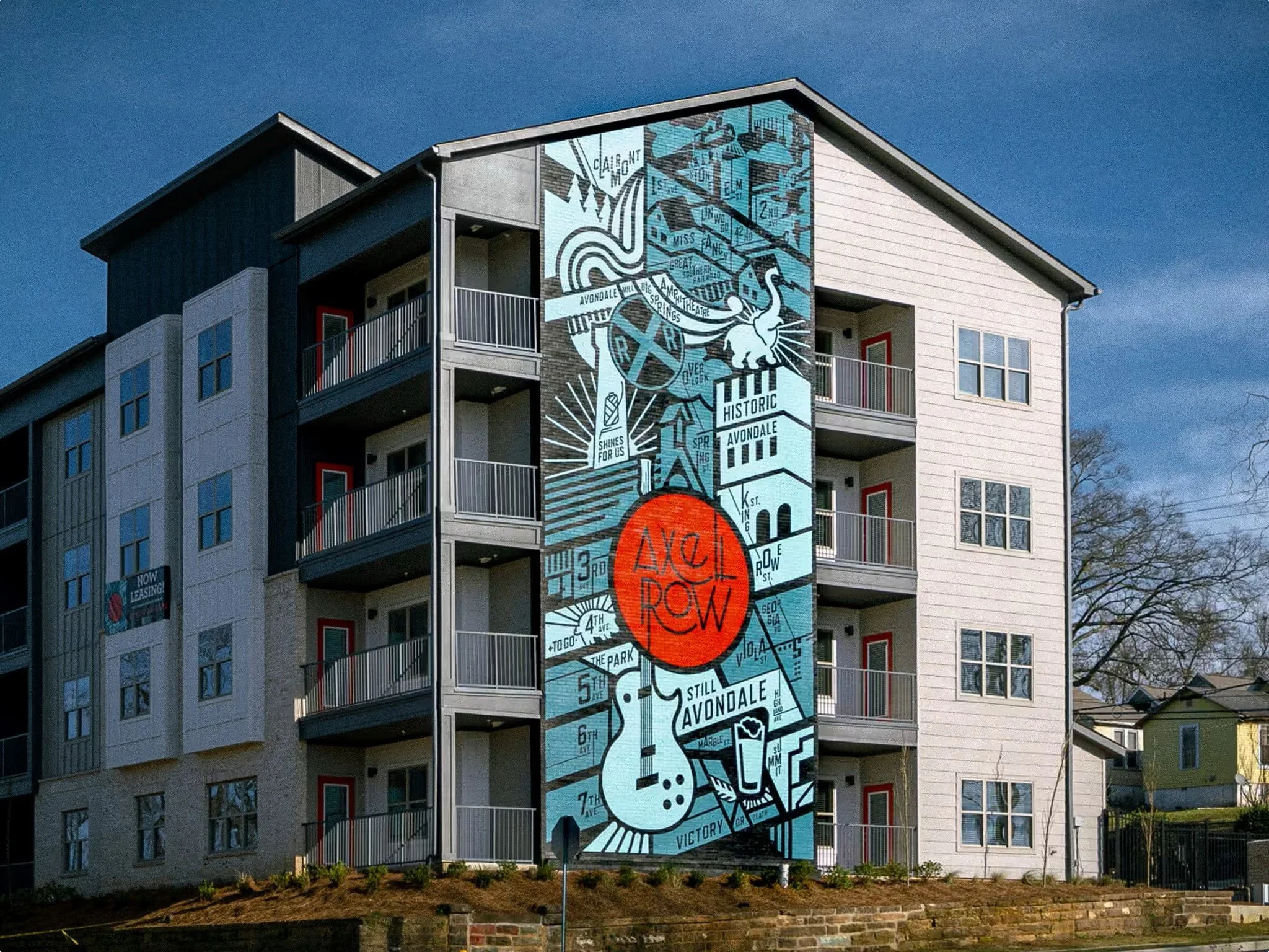 Axel Row Birmingham AL. New, modern apartments offering the latest features and contemporary finishes within one of Birmingham’s most historic neighborhoods–Avondale. Showcasing a 4 story mural on the exterior facade - project by B Group Architecture