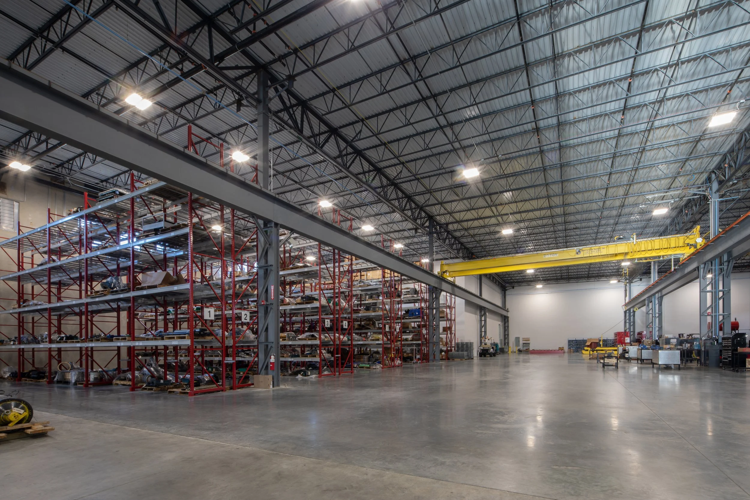 Motion Industries Fluid Power Shop  industrial warehouse with high ceiling and exposed structure and polished concrete floors. project by B Group Architecture, Inc.