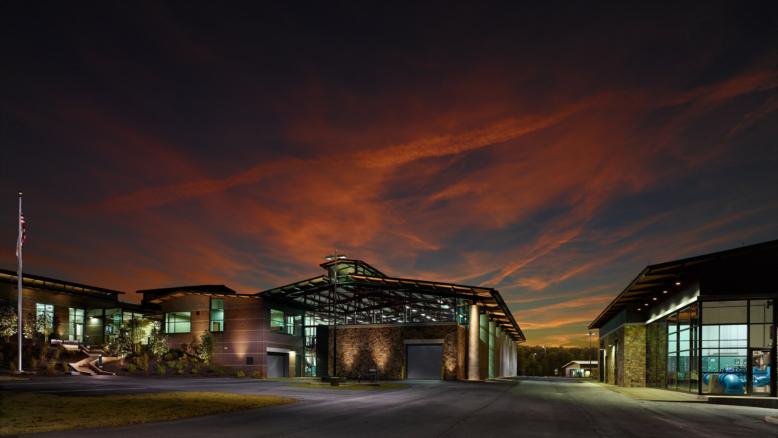 Modern building complex at sunset with a colorful sky and minimal lighting