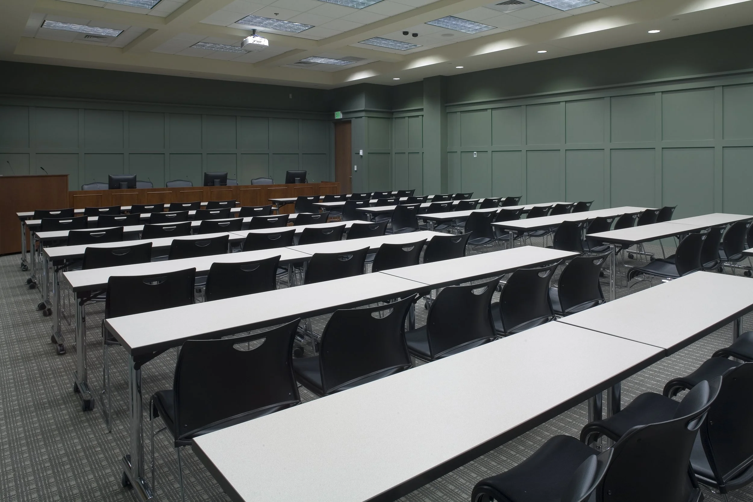 Interior view of Mountain Brook Board Of Education conference room. Walls are painted and accentuated with battens. The furniture is all portable and can be removed from space on dollies   project by B Group Architecture, Inc.