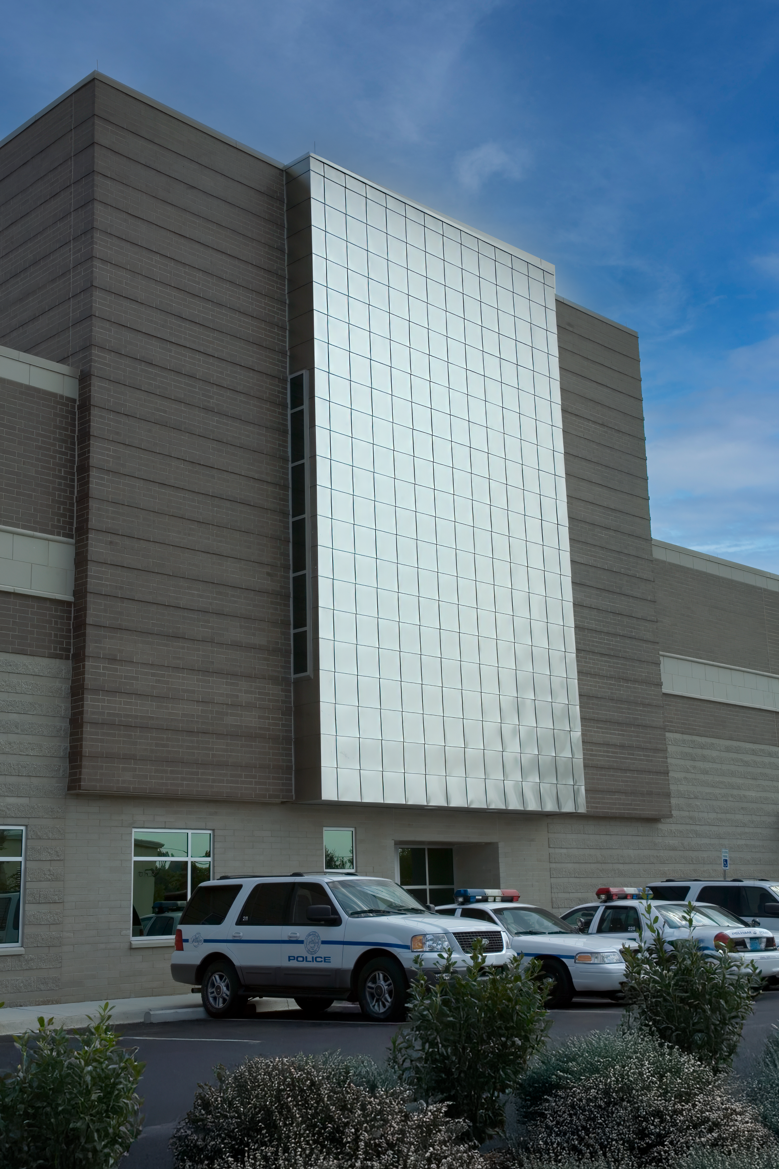 Pelham, AL Police Department's modern building clad in metal panels, brick and cast stone trim. project by B Group Architecture Inc,