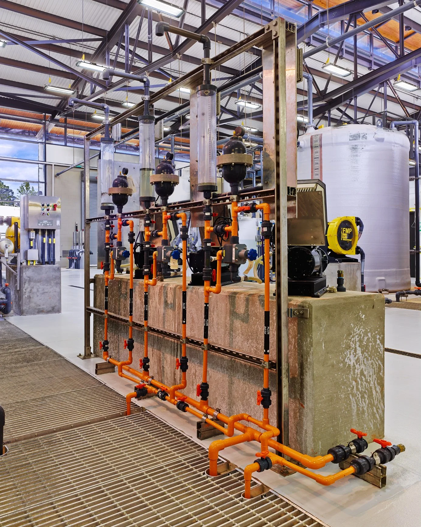 Industrial water treatment facility with tanks, and filtration equipment. project by B Group Architecture,  Inc.