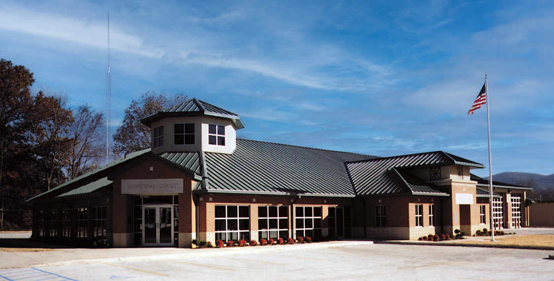 The Piedmont, Alabama Fire Station building with a brick exterior, green metal roof and cupola. project by B Group Architecture, Inc.