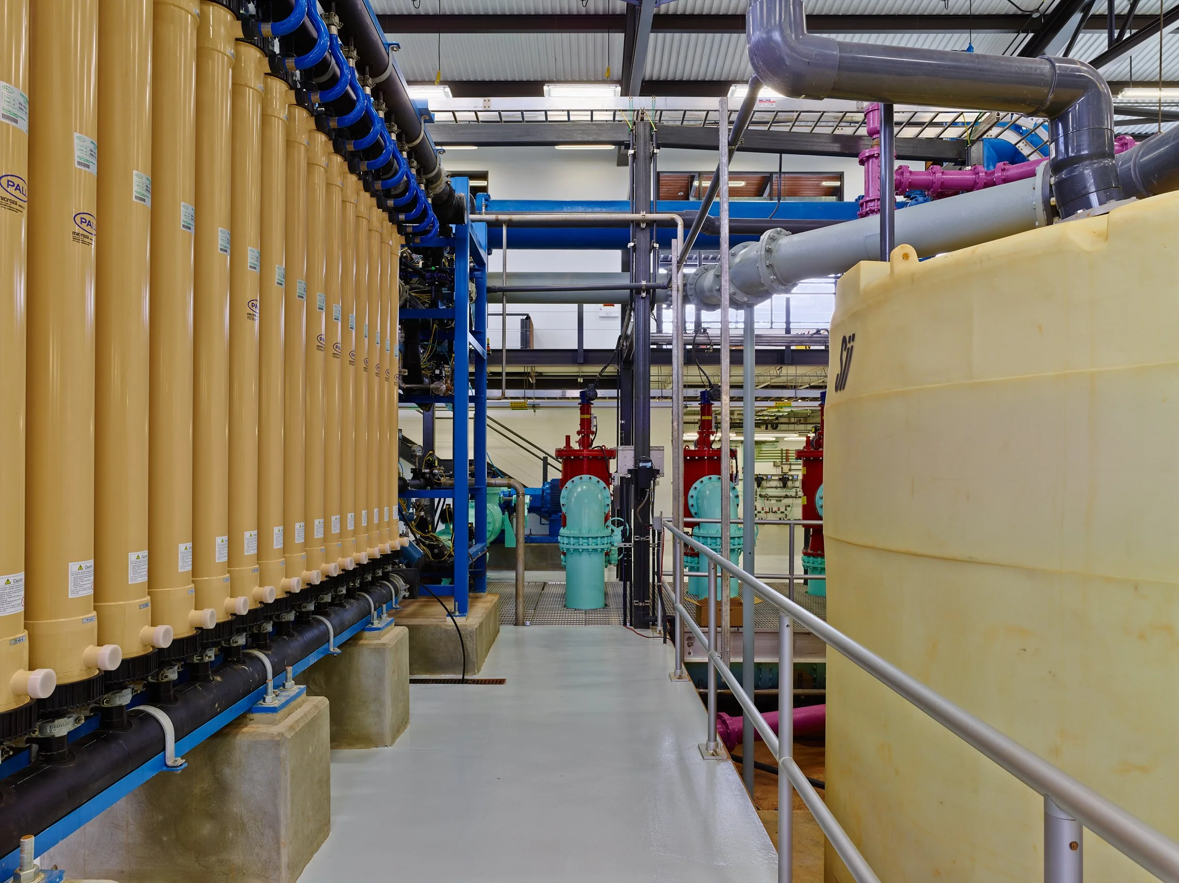 Industrial water treatment facility with tanks, and filtration equipment. project by B Group Architecture,  Inc.