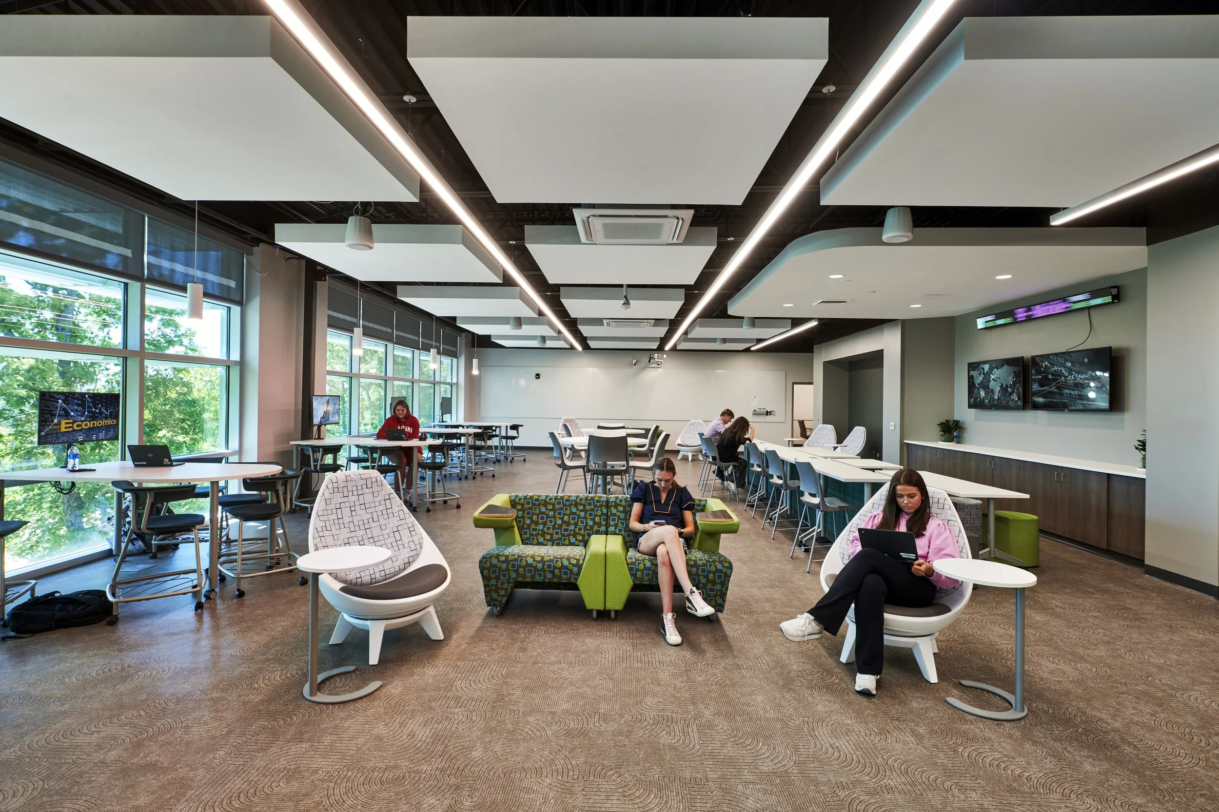 Modern classroom with large windows. Furniture is all internally powered for work purposes - project by B Group Architecture, Inc.