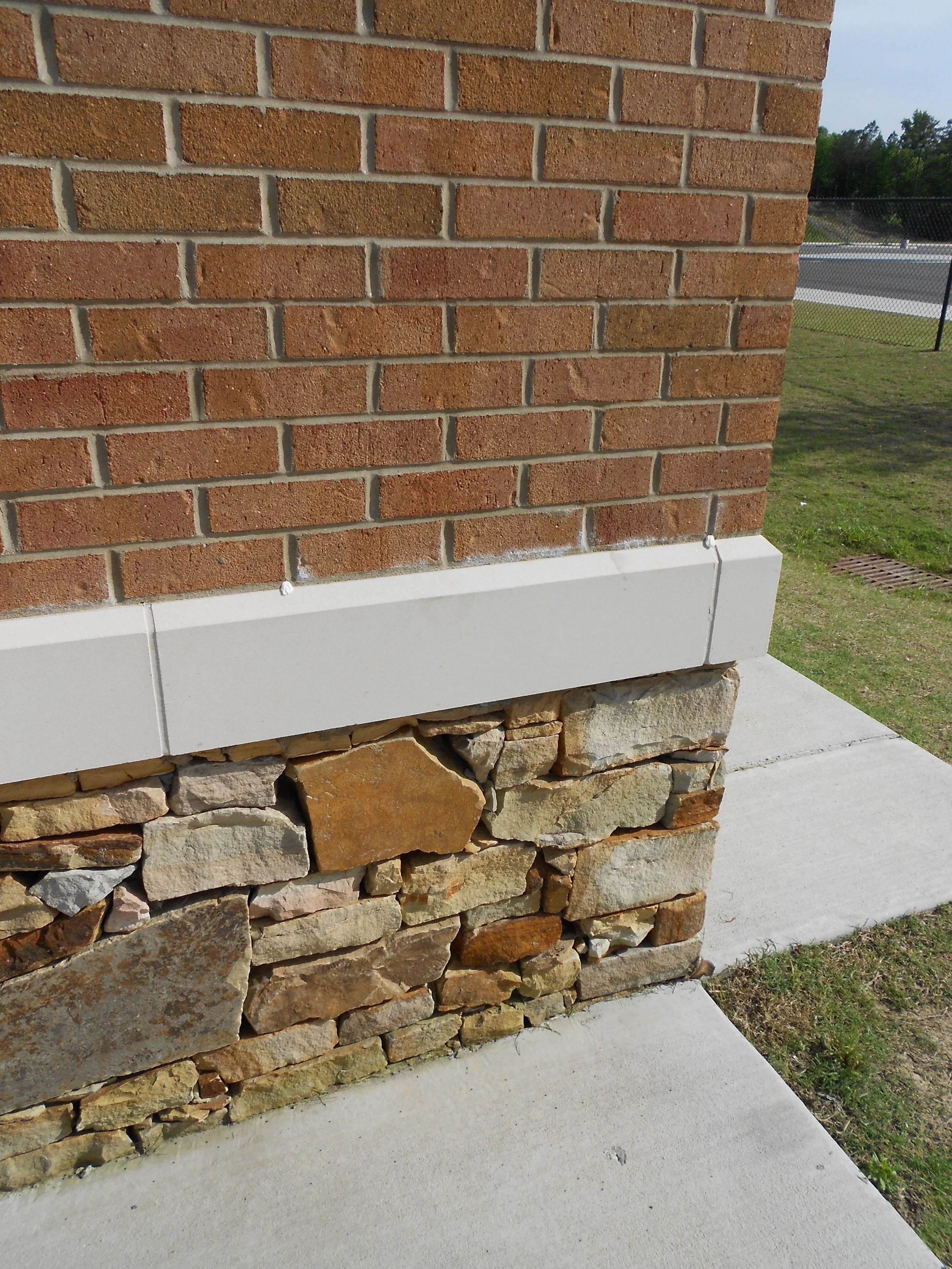 Closeup view of the stone and brick at the  Vestavia Sports Park project by B Group Architecture, Inc.