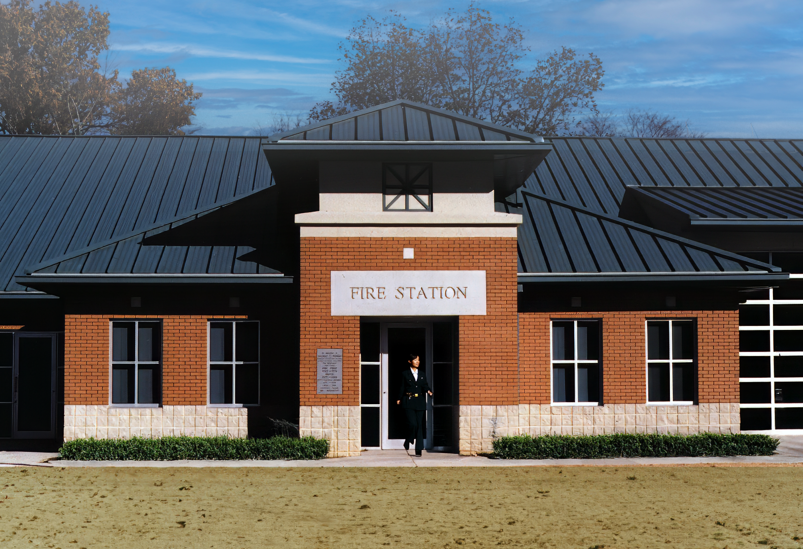 The Piedmont, Alabama Fire Station building with a brick and cast stone exterior, metal roof and cupola. project by B Group Architecture, Inc.