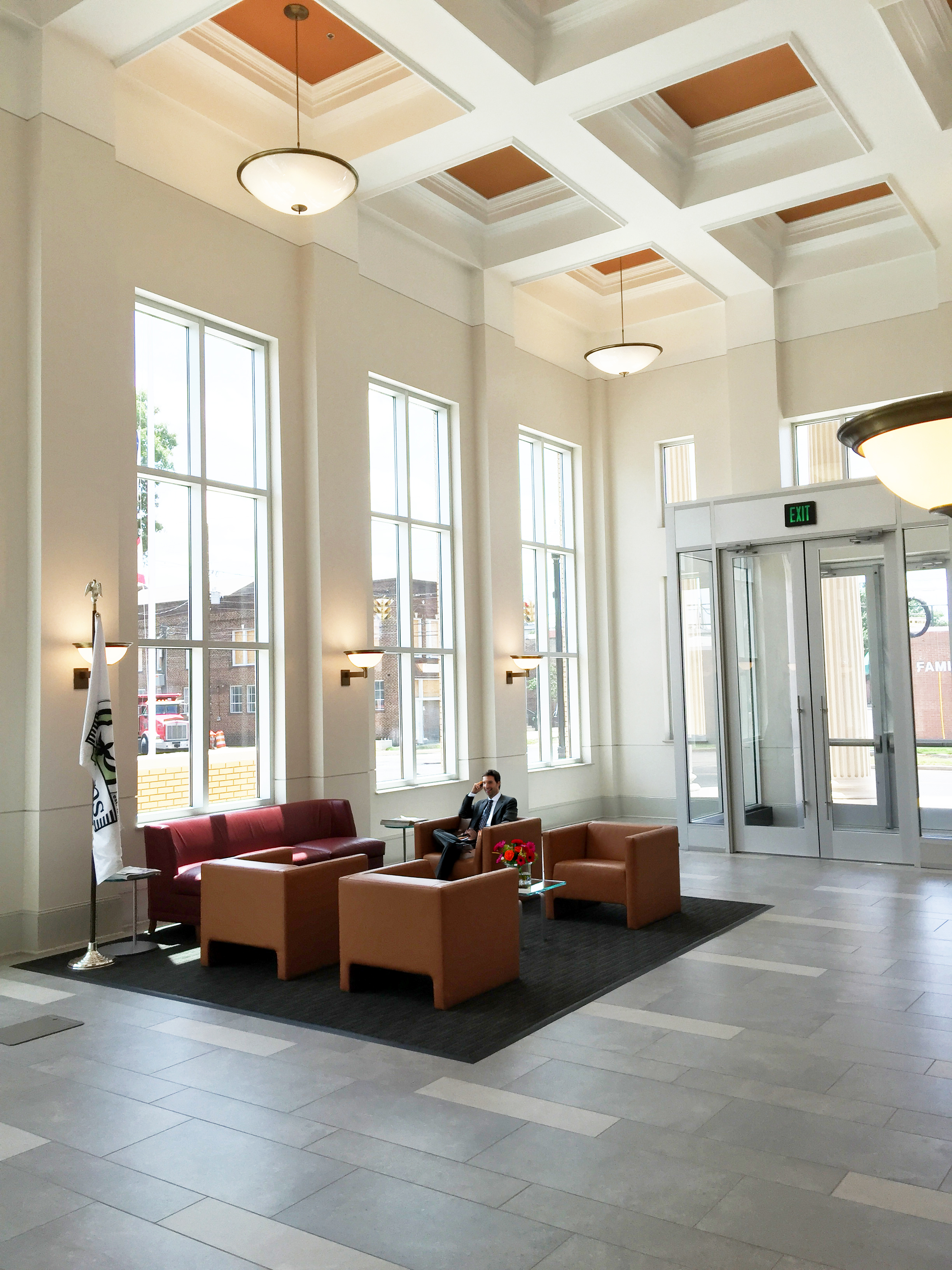 An interior view of the lobby of Athens City Hall with soaring vaulted ceilings and an incredible amount of natural lights.- project by B Group Architecture, Inc.