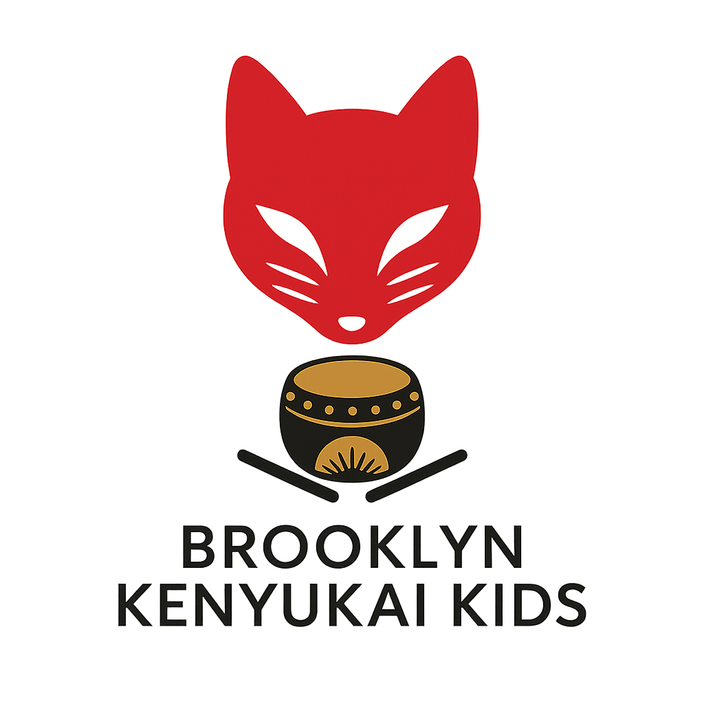 A logo featuring a red fox head with purple eyes above a black and gold ceremonial drum, with the words 'Brooklyn Kenyukai Kids' below.