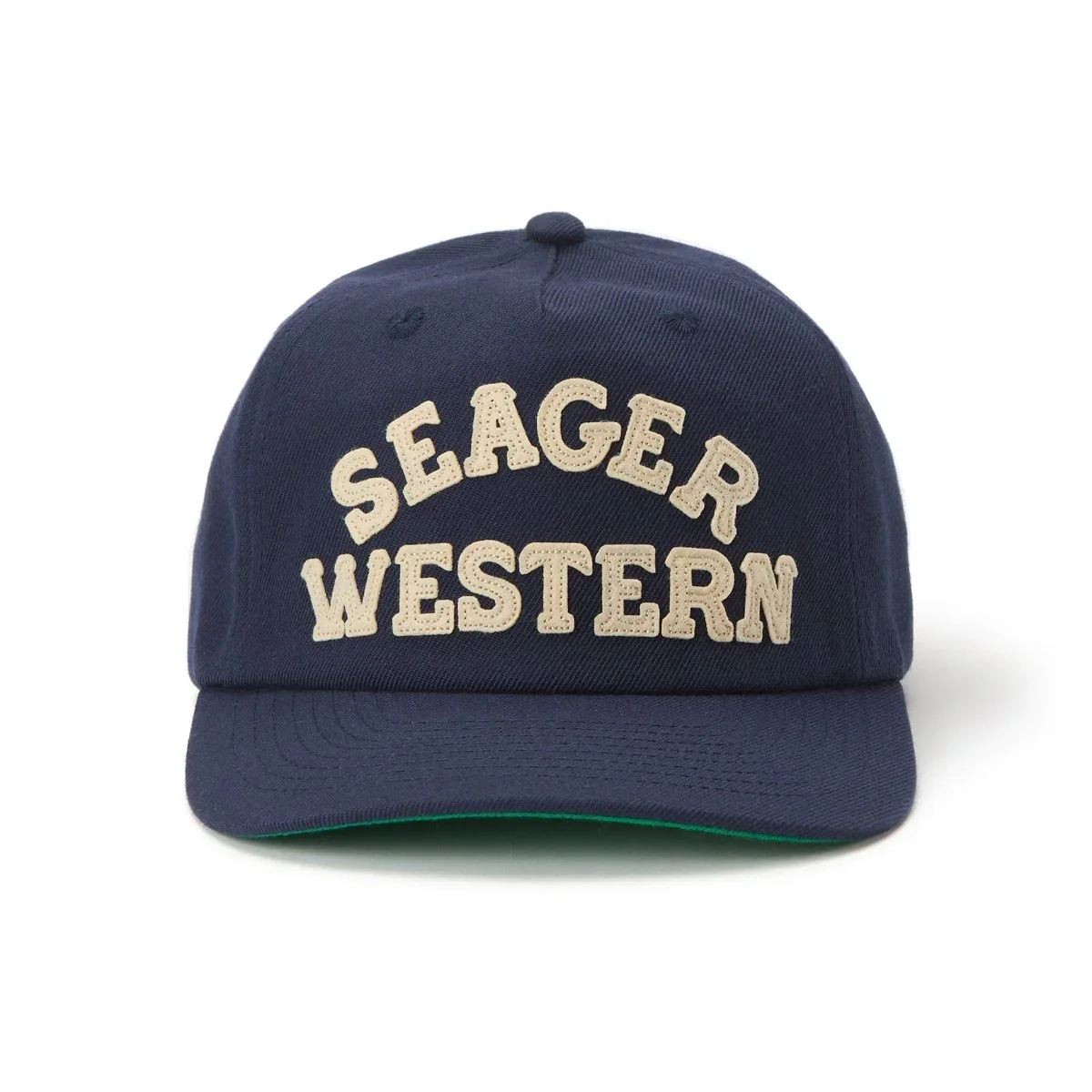 Dark blue baseball cap with beige embroidered text 'SEAGER WESTERN' on front
