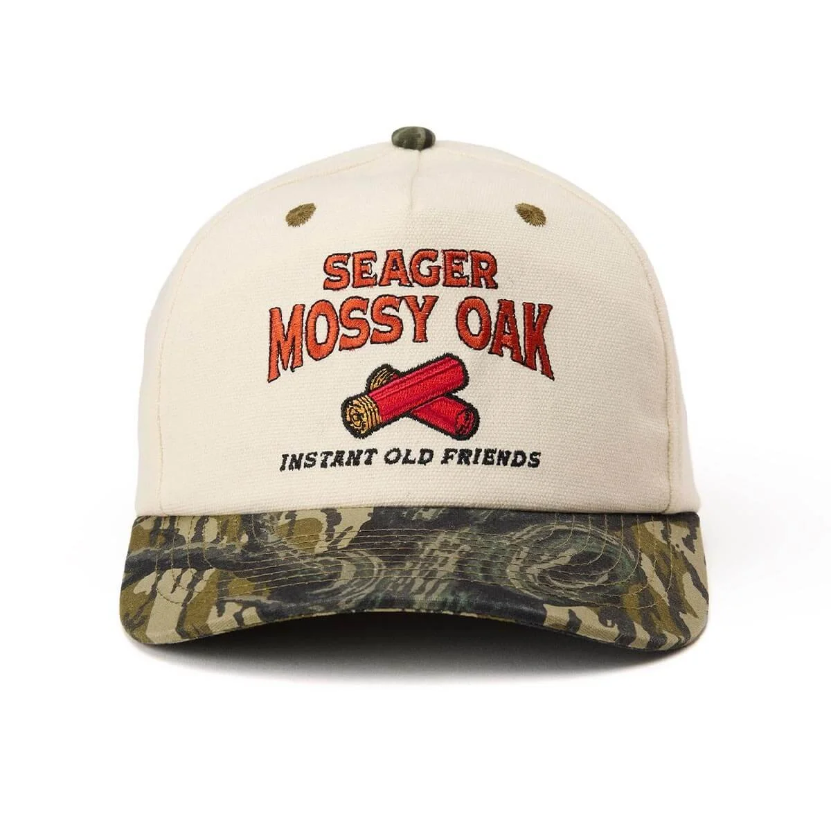 A beige baseball cap with embroidered red text reading "SEAGER MOSSY OAK," a graphic of crossed logs, and the phrase "INSTANT OLD FRIENDS," with a camouflage pattern on the brim.