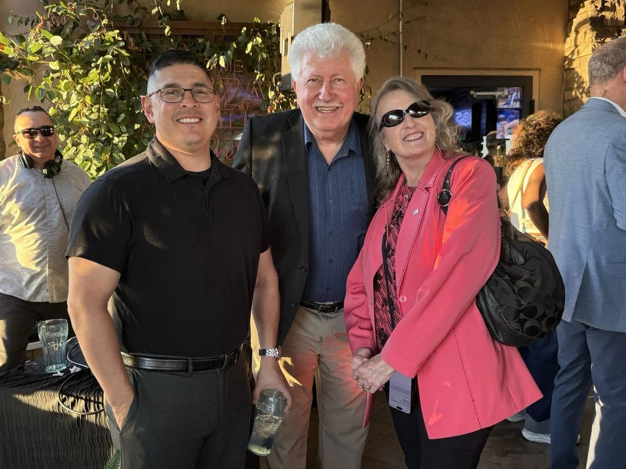 Three guests posing for a photo.