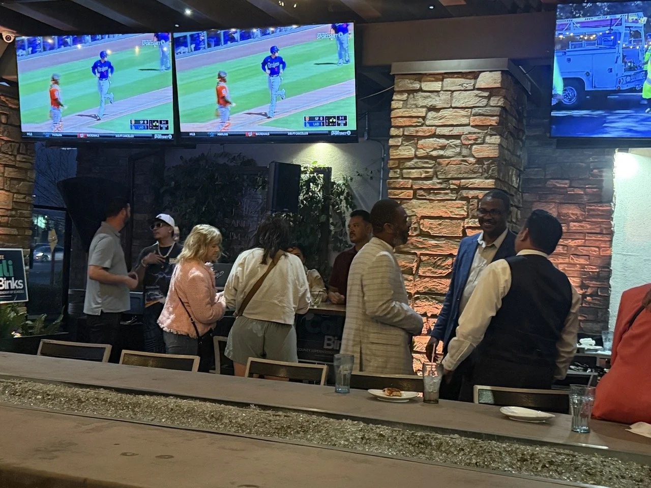 A medium size crowd of of guests networking. 