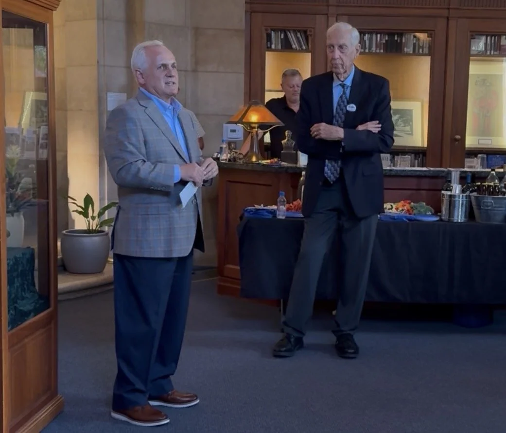 Neal speaking to the community with Dr. Herb Fischer next to him