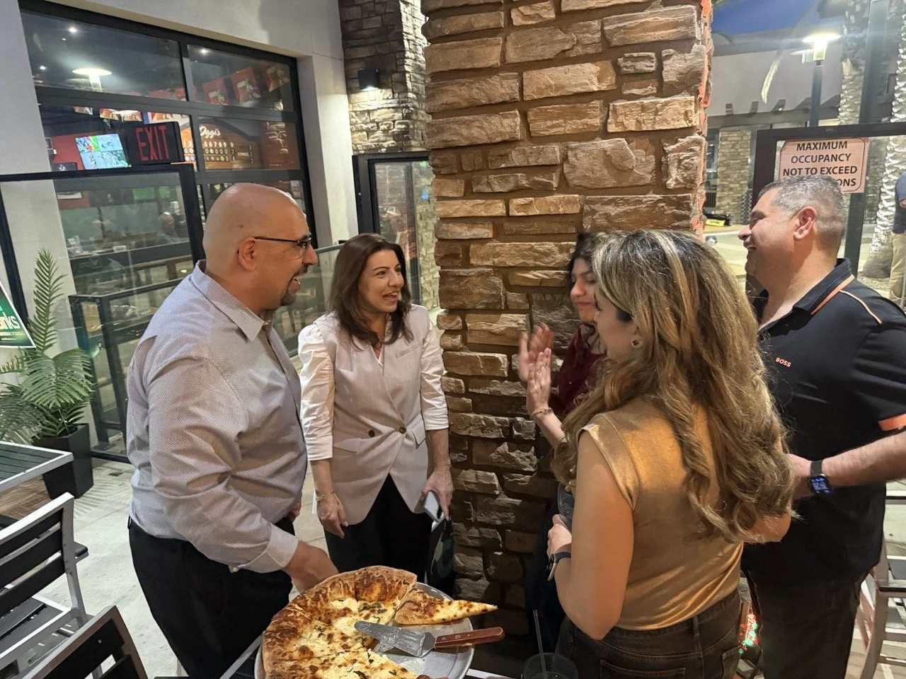 A group of five guest networking.