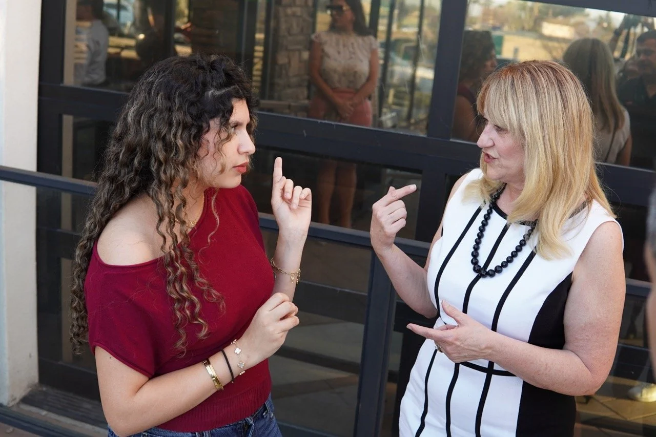 Cali speaking to former Los Osos High School student in a different angle.