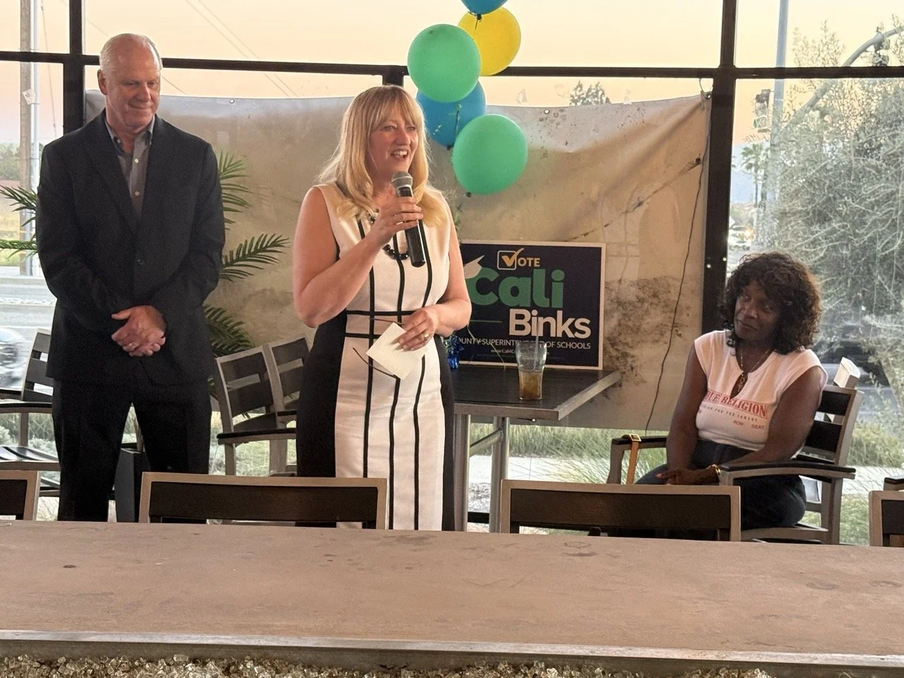 Cali speaking to the event guests.